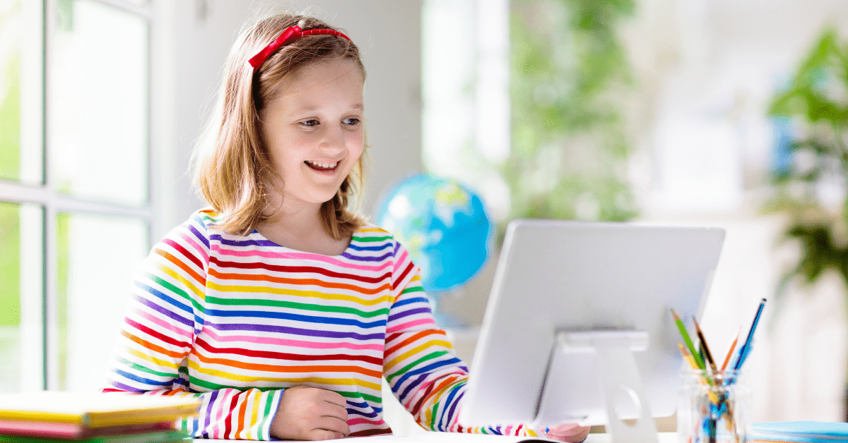 Back-to-School-with-Internet-from-HTC Young girl uses a computer as she starts back to school.