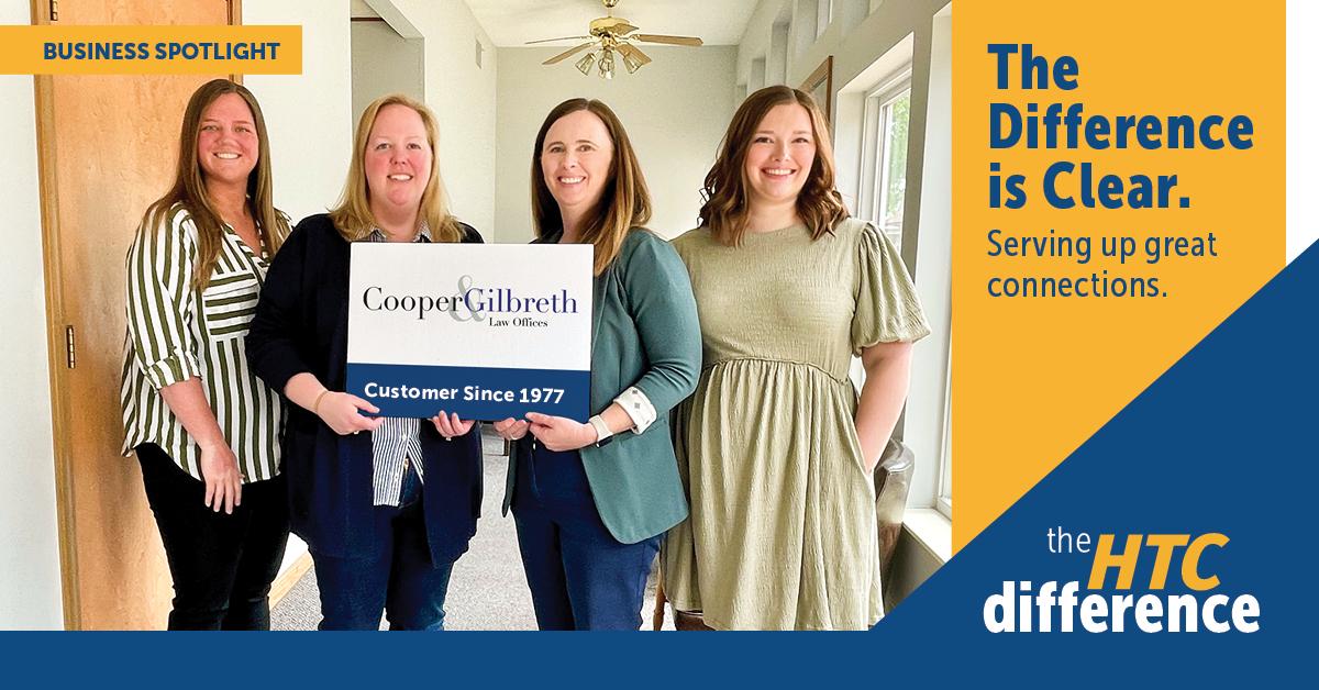 The Cooper & Gilbreth team smiles in a photo at their office in this header graphic that also features the words "The Difference is Clear" and the HTC logo