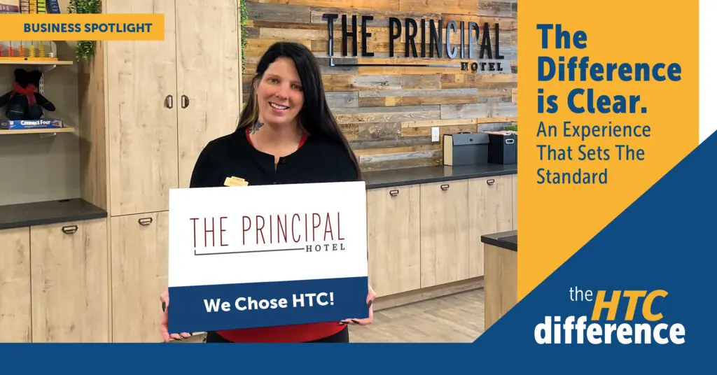 Blog header graphic with an image of a Principal Hotel employee smiling and holding a sign that reads "The Principal Hotel" and "We Chose HTC!"