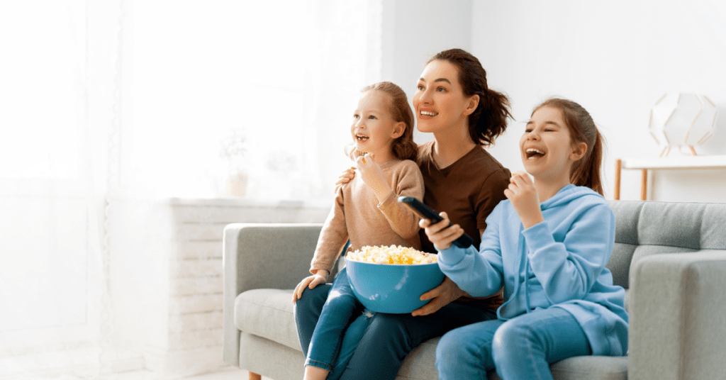 Family streaming TV together because they have high-speed Internet that enhances their streaming experience.